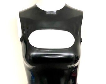 May include: A glossy black crop top with a large oval cutout across the chest. The sleeveless top is made of a shiny material and is displayed on a white mannequin torso. The top has a high neckline and a fitted silhouette.