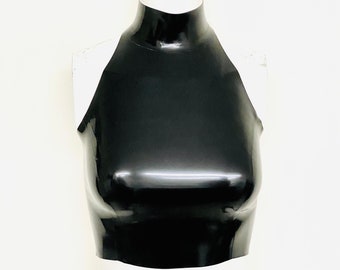 May include: A black halter top made of shiny material. The top has a high neckline and a fitted silhouette. The garment is displayed on a white mannequin against a white background. The top appears to be made of latex or a similar material.
