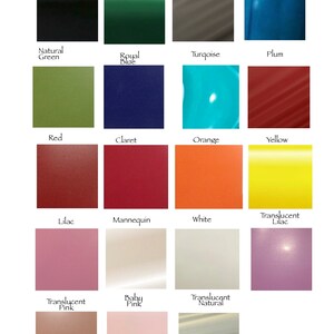May include: A color chart with 18 different paint colors, including black, green, blue, red, orange, yellow, white, pink, and lilac. The colors are arranged in a grid pattern.