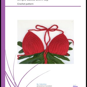 Peut inclure: Un haut de bikini rouge en crochet avec un n&oelig;ud au cou. Le haut est sur un fond de feuille verte.