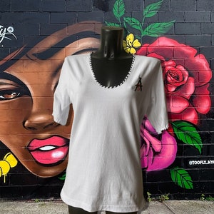 White women's skinny fit t-shirt, elbow sleeves, handmade deep neckline, embroidered logo: Apostel13