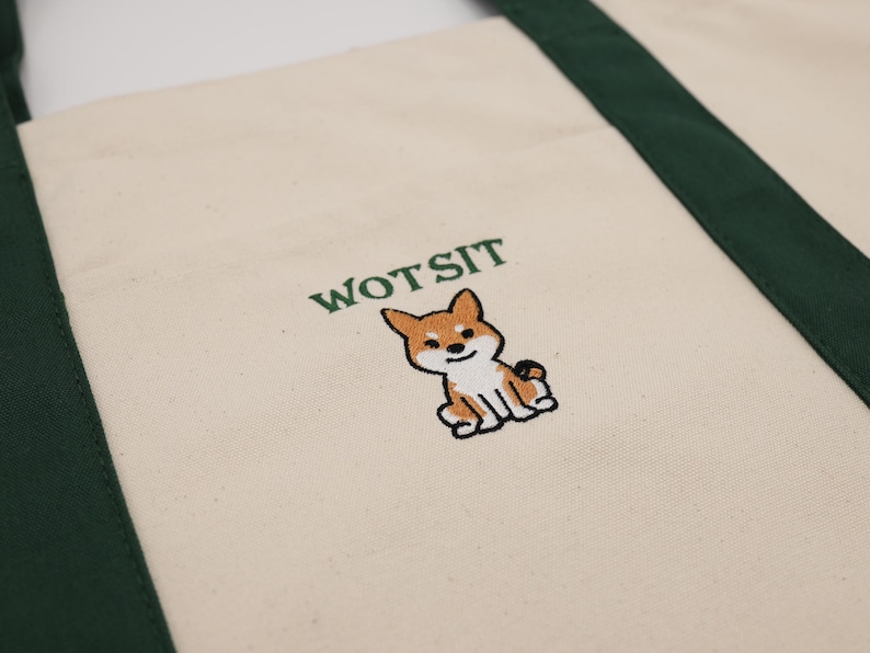 Photo of the a green piped dog bag with Wotsit