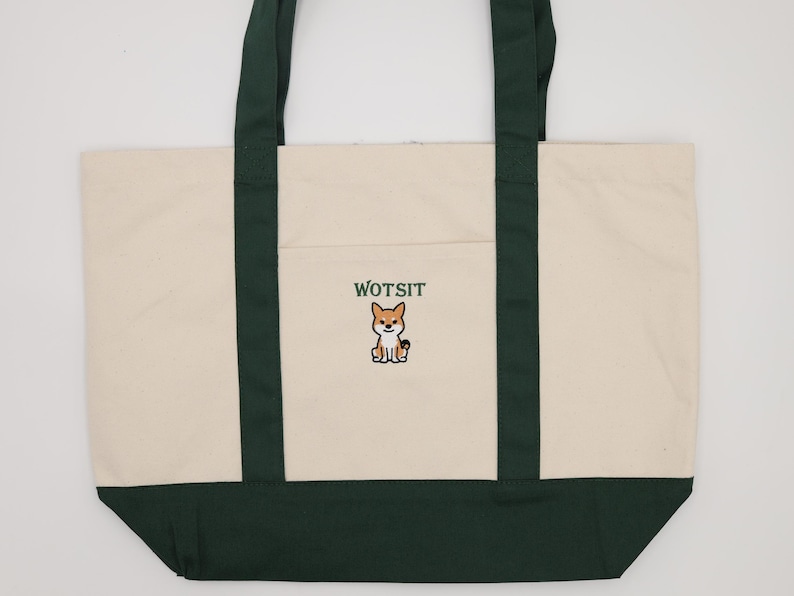 Full Photo of the a green piped dog bag with Wotsit