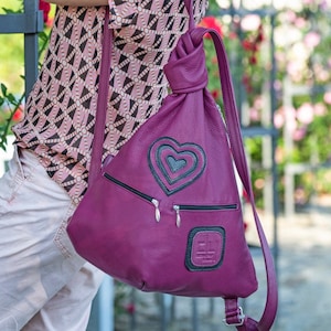 Handmade Leather Backpack with Heart Ornaments – Unique, Stylish