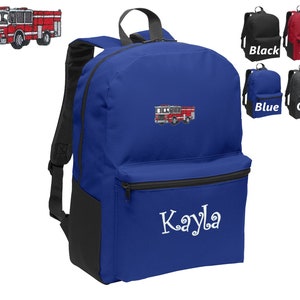 May include: Blue backpack with a black front pocket and a red fire truck embroidered on the front. The backpack has a black zipper and the name "Kayla" is embroidered on the front pocket.