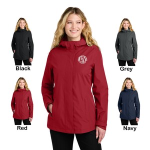 May include: A red hooded jacket with a white monogram on the left chest. The jacket is shown in multiple colors, including black, grey, and navy.