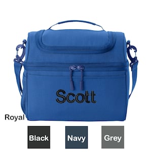May include: Royal blue insulated lunch bag with a black zipper and a black embroidered name "Scott". The bag has a black strap and a mesh pocket on the side. The bag is shown against a white background with color swatches for black, navy, and grey.