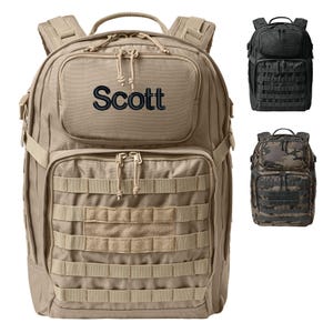 May include: A tan backpack with the name "Scott" embroidered in navy blue. The backpack has multiple compartments, adjustable straps, and a MOLLE webbing system. Additional backpacks in black and camouflage are also shown.