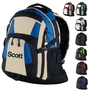 May include: A black, blue, and beige backpack with a mesh pocket on the side. The backpack has a zippered compartment and a name tag that says "Scott".