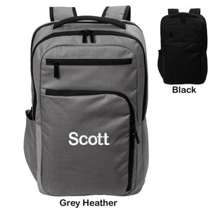 May include: A grey heather and black backpack with a zippered front pocket and the word "Scott" embroidered on the front. The backpack is shown next to a black version of the same backpack.