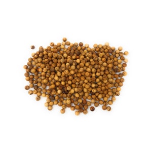 May include: A large pile of brown wooden beads, scattered on a white background.