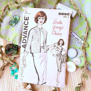 May include: Vintage sewing pattern envelope for a dress and jacket. The pattern is by Advance and is called "Loretta Young's Choice". The pattern number is 9866 and the size is 11.