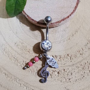 Piercing navel music note in surgical steel.