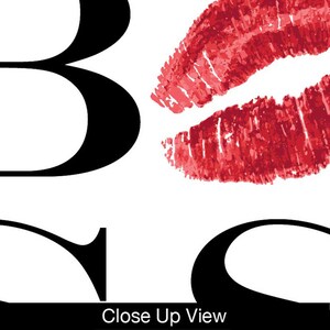 May include: Black and white graphic with the word "Kiss" in large letters. The letter "S" is replaced with a red lipstick kiss mark.