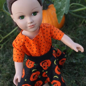 Jack-o-lanterns highlight this shirt & skirt outfit that fits 18-inch Dolls like American Girl. Perfect for trick-or treat or Halloween gift