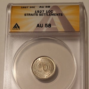 May include: A silver coin from 1927, graded AU 58 by ANACS, is displayed in a clear plastic holder. The coin is a Straits Settlements 10 cents coin, featuring the text "STRAITS SETTLEMENTS TEN CENTS 1927".