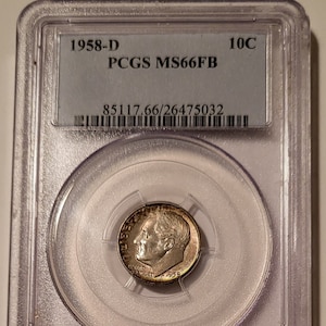May include: A 1958-D 10c US dime graded MS66FB by PCGS in a plastic slab with the grading label visible. The coin is in excellent condition and has a silver finish.
