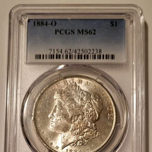 1884 O Morgan Silver Dollar MS62 PCGS Lightly Toned