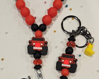 Llavero de silicona con cuentas de camión todoterreno y dije de patito en rojo