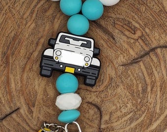 Pulsera o llavero con colgante de silicona para camioneta todoterreno 4x4 con dije de pato en color verde azulado y blanco