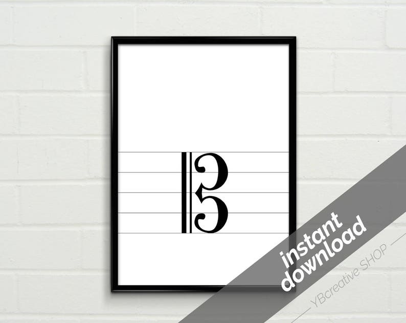 May include: Black and white printable music notation for a bass clef with the number 3 on a white background.