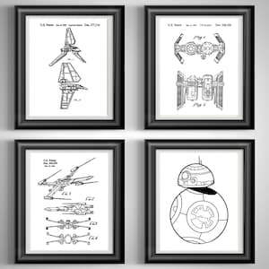 May include: Four framed black and white patent prints featuring Star Wars spacecraft and a droid. The prints include schematics of an Imperial Shuttle, TIE Bomber, X-wing, and BB-8. Each print is in a black frame with a white mat.