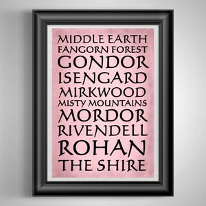 May include: A framed print with a black frame featuring a pink background and black text. The text lists locations from Middle Earth, including Gondor, Isengard, Mirkwood, and Mordor. The print is a decorative item.