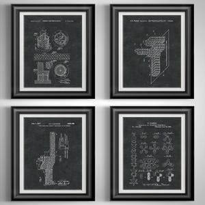 May include: A set of four framed wall art prints featuring black and white technical patent illustrations on a dark background. Each print displays detailed engineering diagrams, schematics, and text labels related to various scientific inventions.