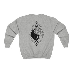 May include: Gray sweatshirt with a black yin yang symbol and the text "Do no harm but take no shit" printed on the back.