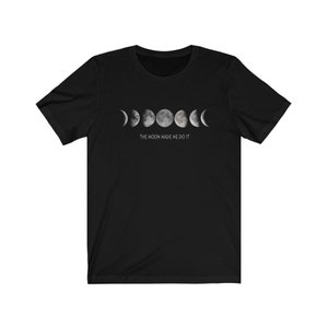May include: Black t-shirt with a graphic of the moon phases and the text "The moon made me do it."