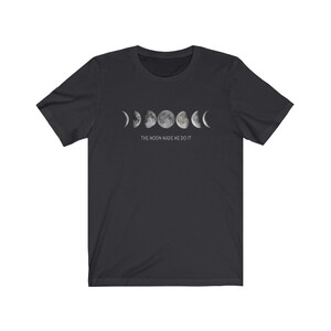 May include: Black t-shirt with a graphic of the moon phases and the text "The moon made me do it."