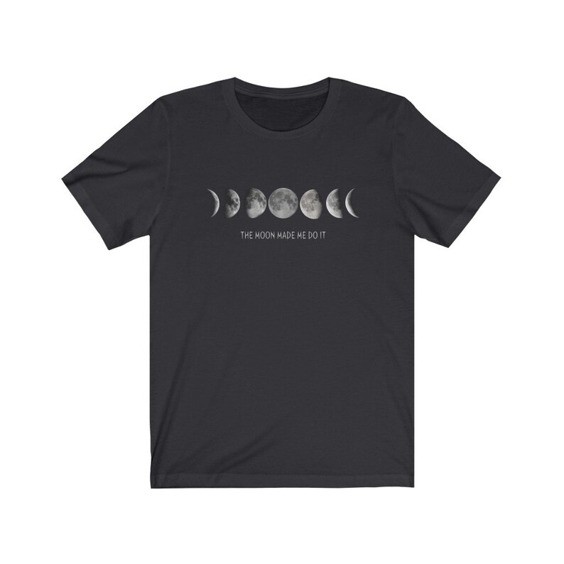 May include: Black t-shirt with a graphic of the moon phases and the text "The moon made me do it."