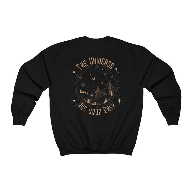 May include: Black sweatshirt with a gold graphic of a mountain range, moon, and stars with the text "The Universe Has Your Back".