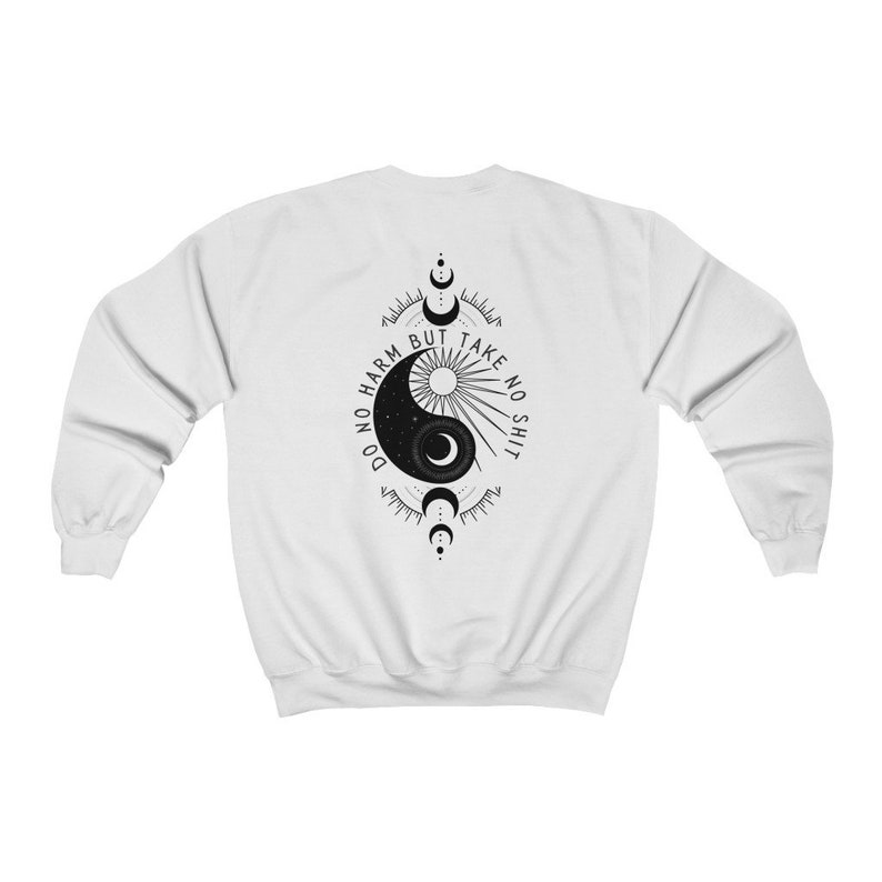 May include: White sweatshirt with a black yin yang symbol and the text "Do no harm but take no shit" printed on the back.