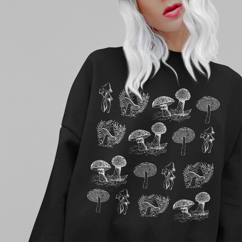 May include: Black sweatshirt with a white graphic print of various mushrooms. The print is a repeating pattern of different types of mushrooms.