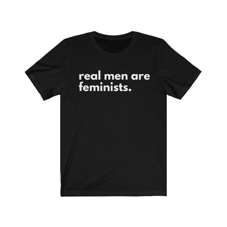 May include: Black t-shirt with white text that reads "real men are feminists."