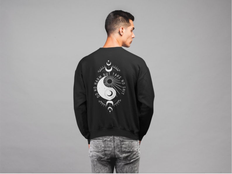 May include: Black sweatshirt with a white yin yang symbol and the text "Do no harm but take no shit" on the back.