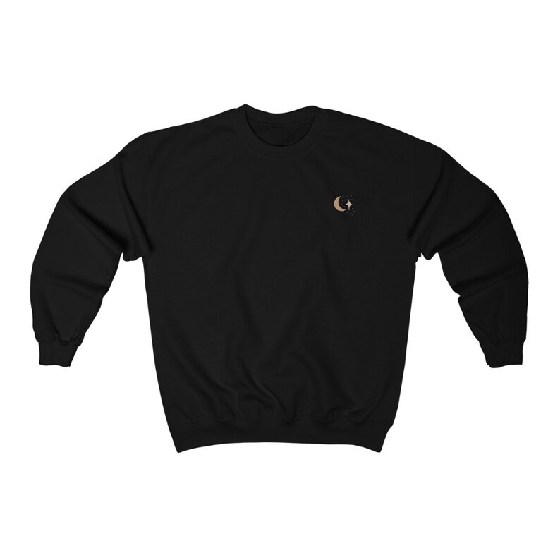 May include: Black sweatshirt with a small embroidered design of a crescent moon and a star.