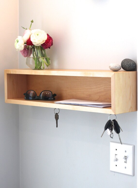 distressed white shelf with hooks