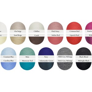 May include: A collection of yarn samples in various colors, including white, beige, pink, red, blue, green, gray, and black. Each color is labeled with its name, such as "White", "Pink Daisy", and "Navy".