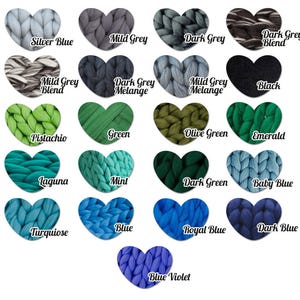 May include: A color chart featuring heart-shaped swatches of chunky knit yarn in various colors. Colors include Silver Blue, Mild Grey, Dark Grey, Black, Pistachio, Green, and more. Each swatch has a color name written below it.