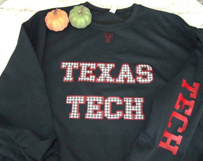 Black TX Tech sweatshirt with red and black and white letterin