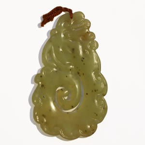 Vintage Hand Carved Serpentine Dragon pendant . ALL NATURAL. Untreated. Yellow-Green. Translucent. 3.5 x 2 ". Ca 1940s(?).