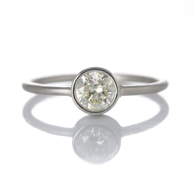 0.54ct diamond engagement ring/simple stacking ring. Pre-owned natural round cut diamond, light yellow, i2, in NEW platinum setting. image 2
