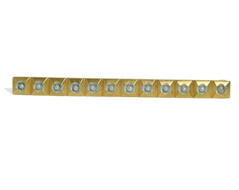 May include: A gold bar brooch with a row of light blue enamel squares, each with a white pearl in the center.