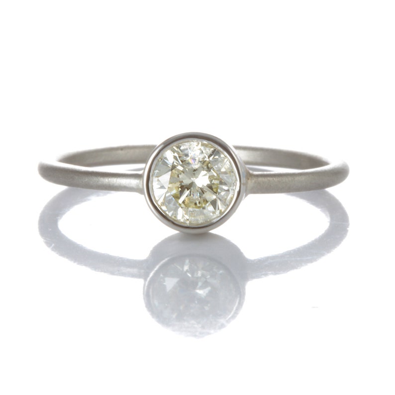 0.54ct diamond engagement ring/simple stacking ring. Pre-owned natural round cut diamond, light yellow, i2, in NEW platinum setting. image 1