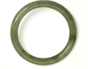 57mm GIA certified untreated type A Jadeite Jade Bangle. All natural, Fei Cui. Translucent medium brownish green. Pre-owned before 2005.