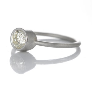 0.54ct diamond engagement ring/simple stacking ring. Pre-owned natural round cut diamond, light yellow, i2, in NEW platinum setting. image 3