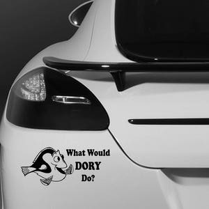 May include: A black and white vinyl sticker featuring a cartoon image of Dory from Finding Nemo. The sticker is on the rear of a white car and includes the text "What Would DORY Do?"