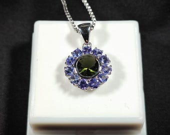 Impresionante colgante de moldavita y tanzanita. Incluye certificado de autenticidad.